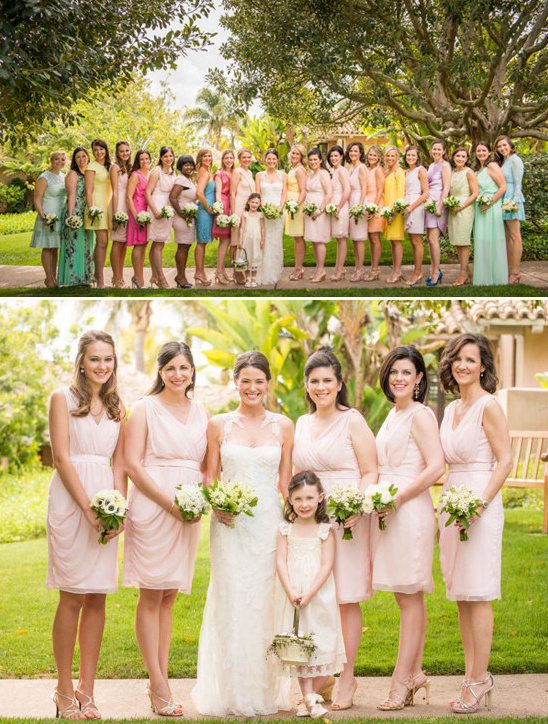 Bride with bridesmaids wearing pastel dresses at outdoor wedding