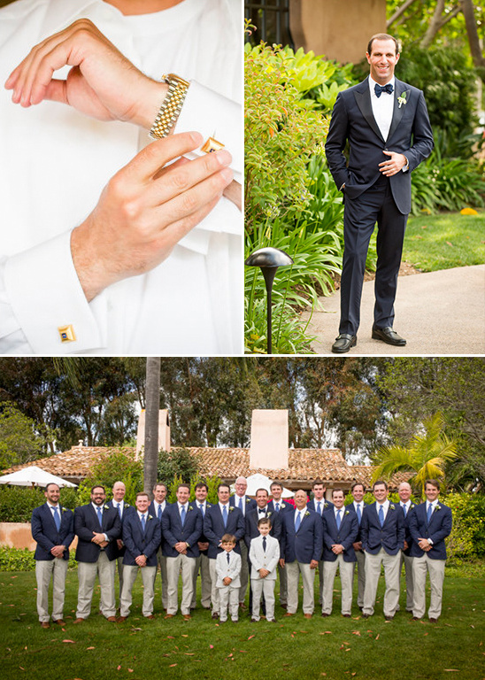 A groom and his groomsmen in stylish wedding attire pose outdoors