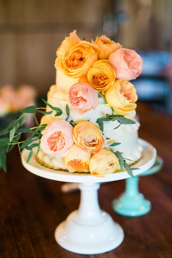 orange garden rose topped cake