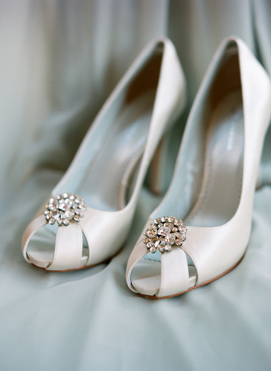 Elegant white wedding shoes with sparkling crystal detail