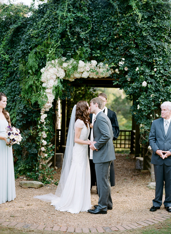 floral covered ceremony arch