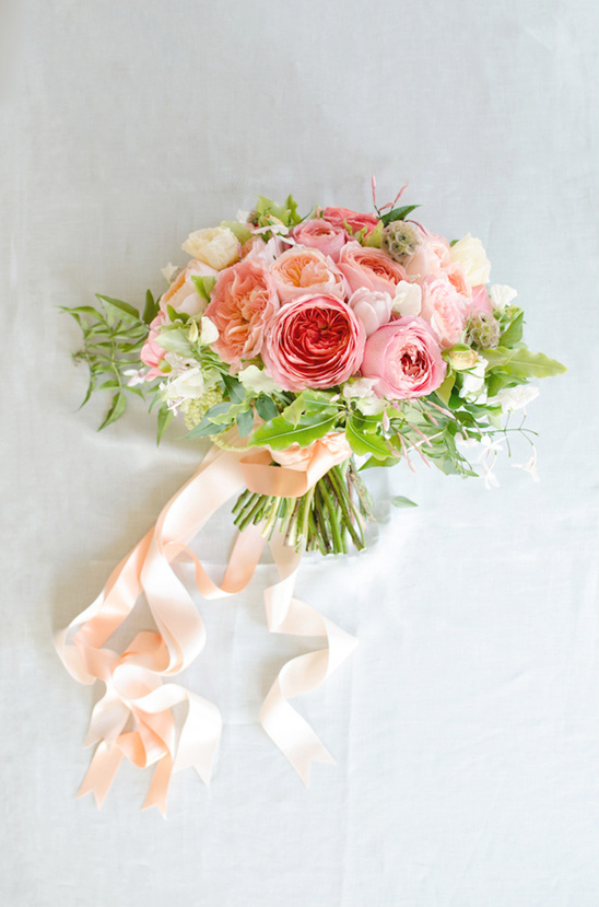 Bridal bouquet of pink and peach roses with silk ribbon