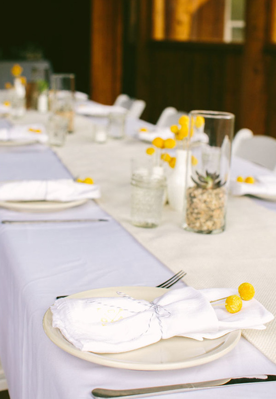 Elegant table setting with yellow flowers, ready for a celebration