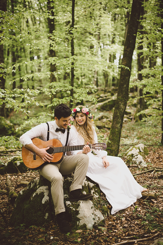 playing guitar in the forest