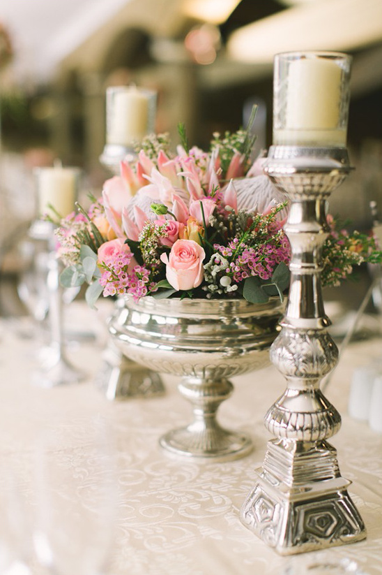 silver candle sticks and pedistal bowl centerpiece