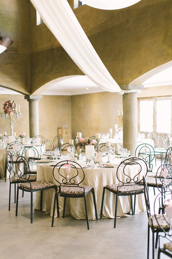 Elegant wedding reception tables with floral centerpieces