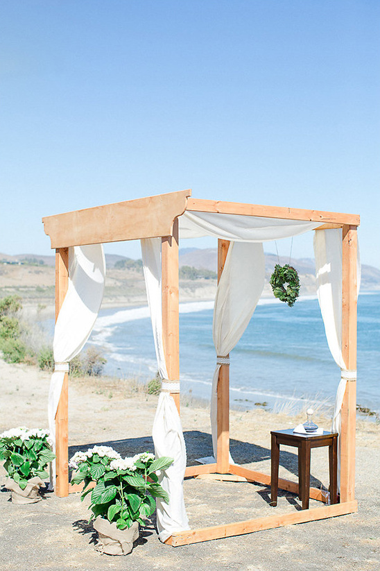 wooden wedding arbor on a cliff