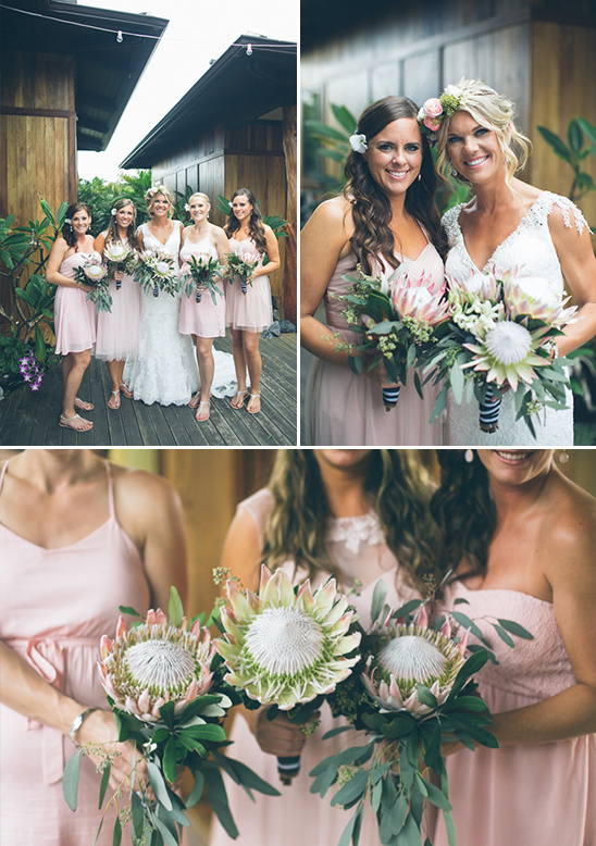Bridesmaids with big protea bouquets at an outdoor wedding