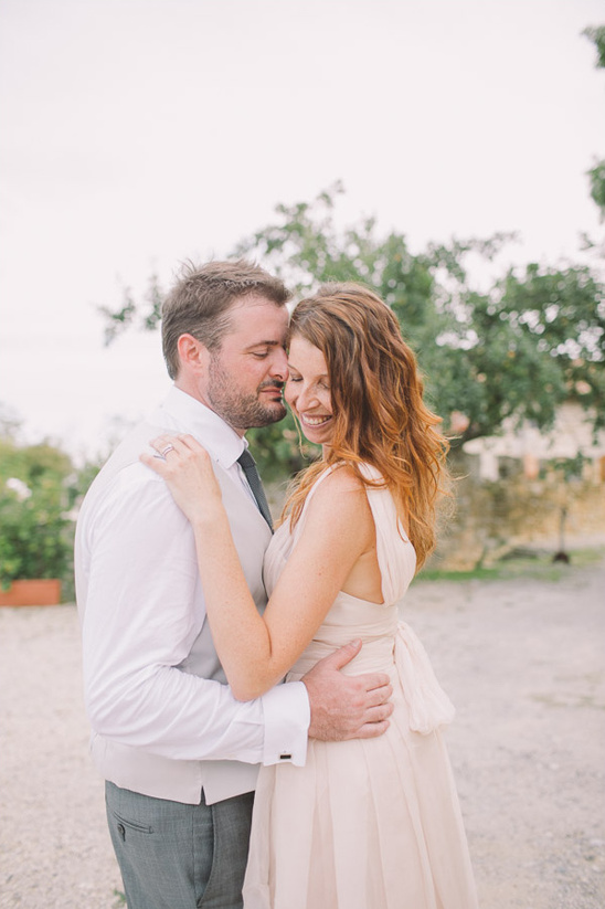 Romantic wedding couple embracing outdoors in love