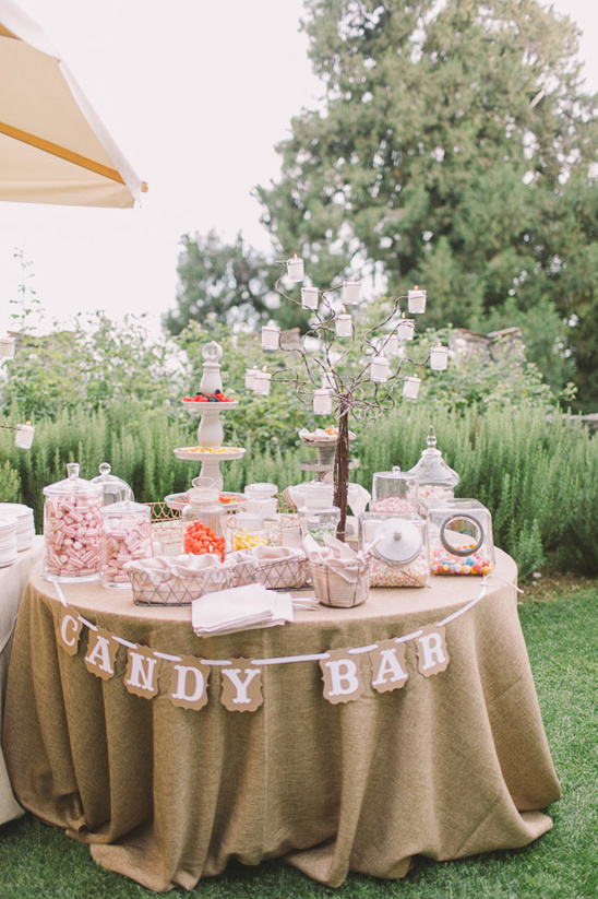 Outdoor candy bar at a wedding reception table display