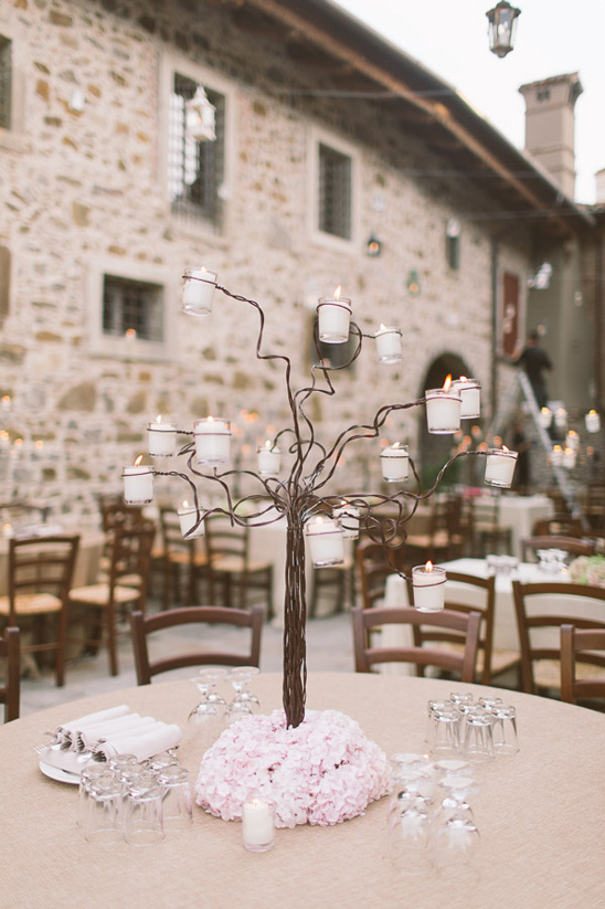 Elegant wedding centerpiece with candle tree decor