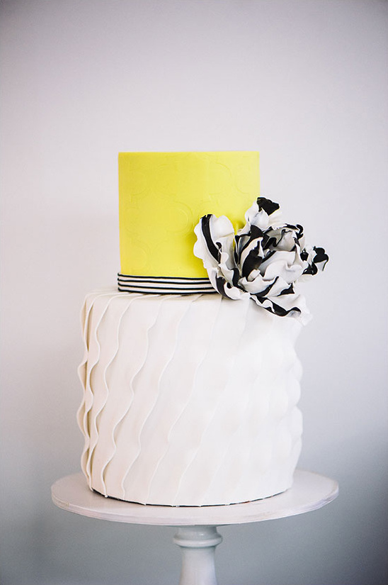 white yellow and black wedding cake