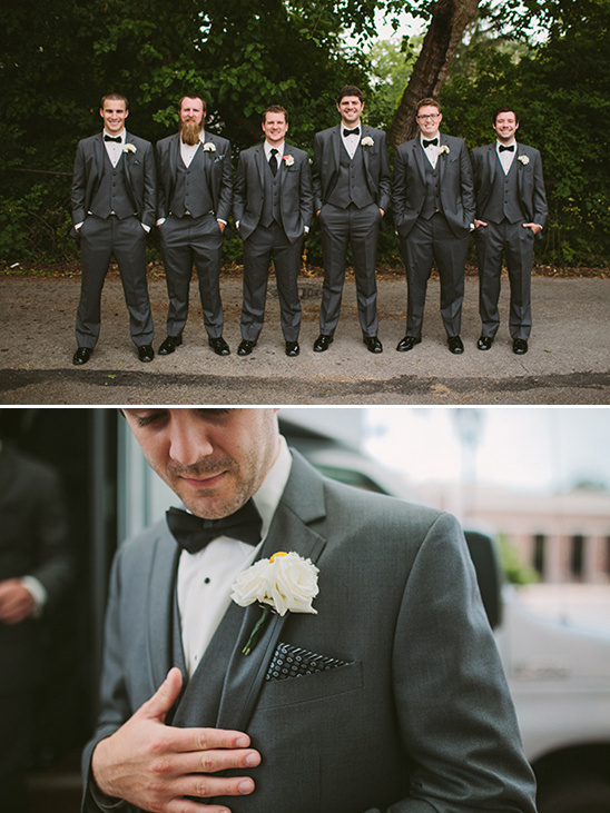Goom and his men in gray suits with black bow ties
