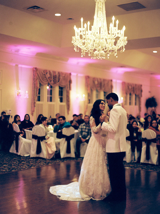 Bride and groom share their first dance at wedding reception