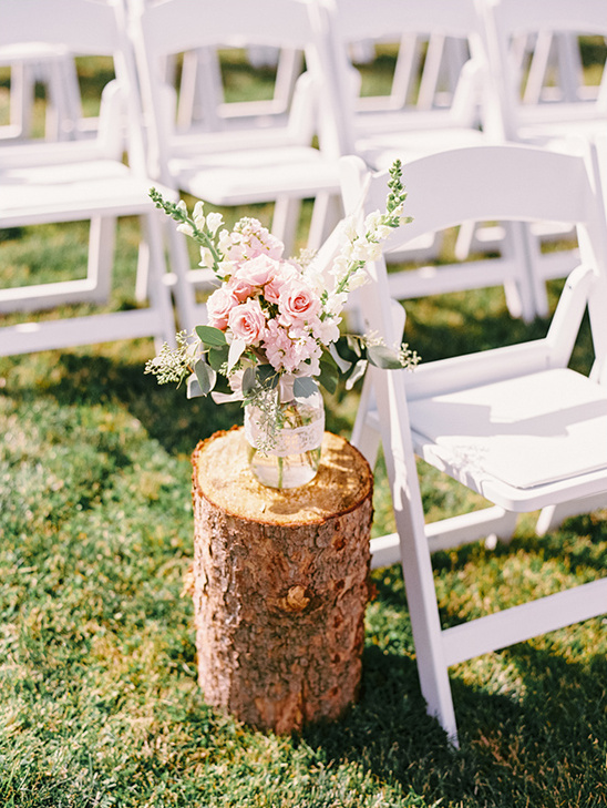 wood stump with floral ceremony decor