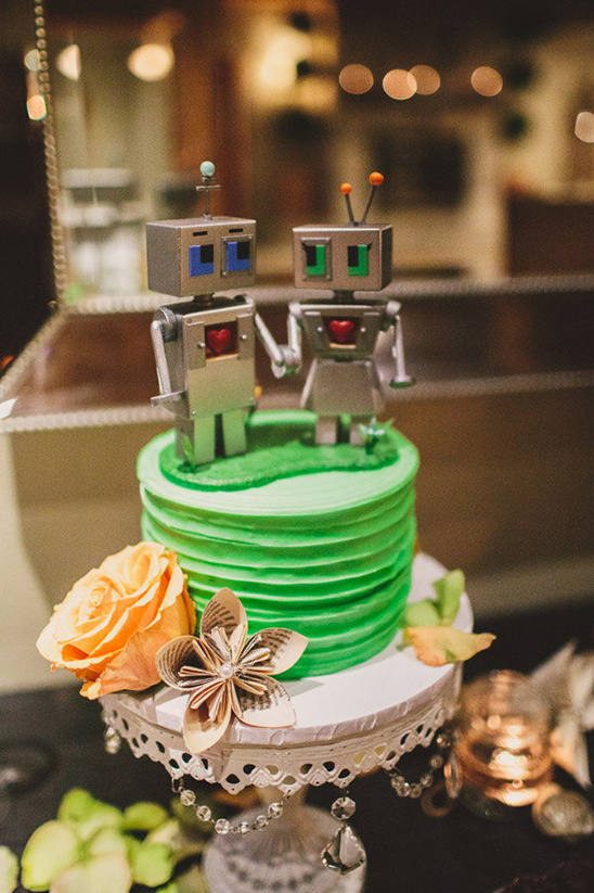 green wedding cake with robot toppers