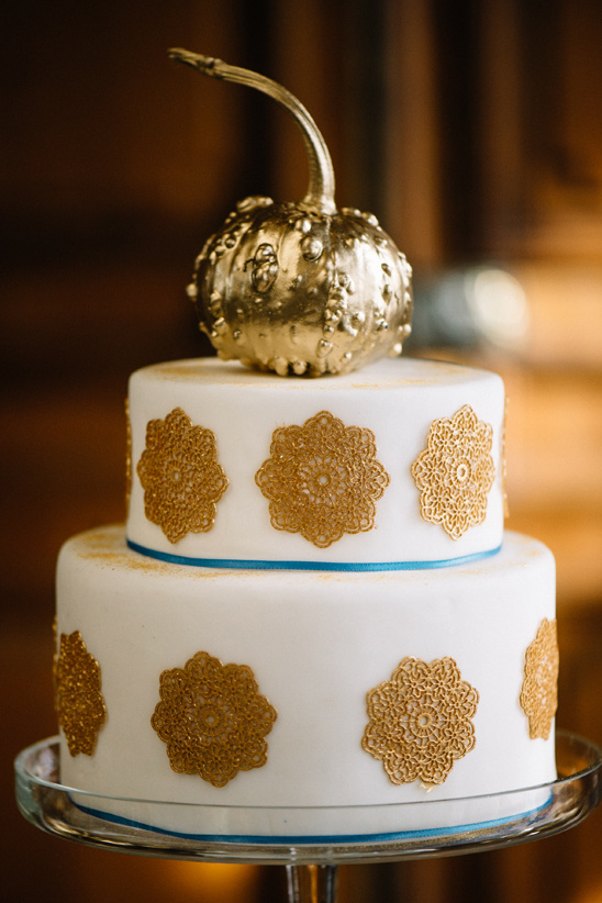 gold pumpkin topped wedding cake