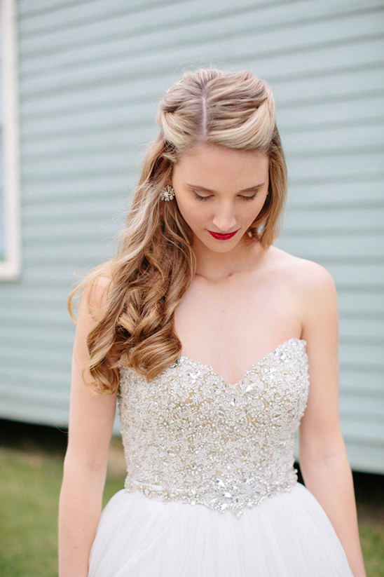 Bride in beaded wedding dress with elegant hairstyle