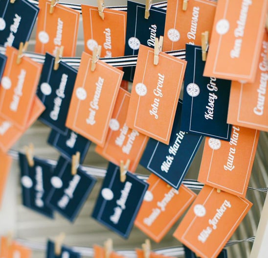 orange and navy escort cards @weddingchicks