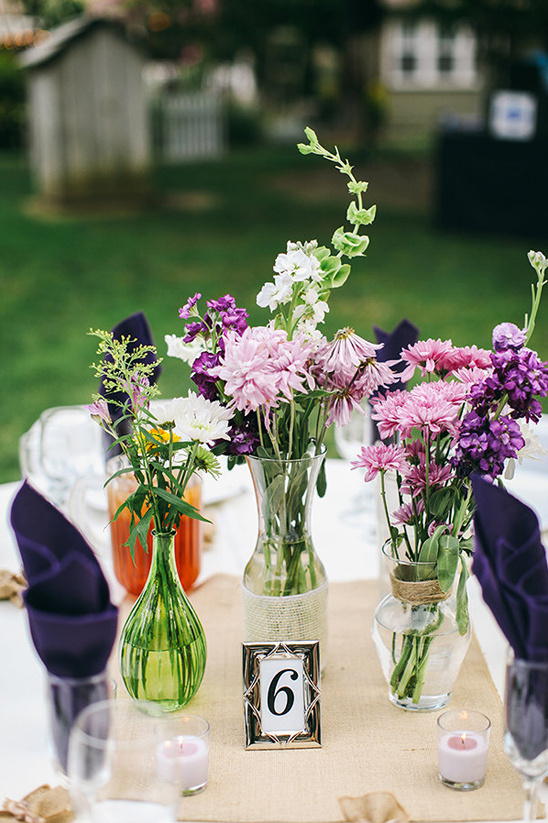 wild flower centerpieces and framed table number