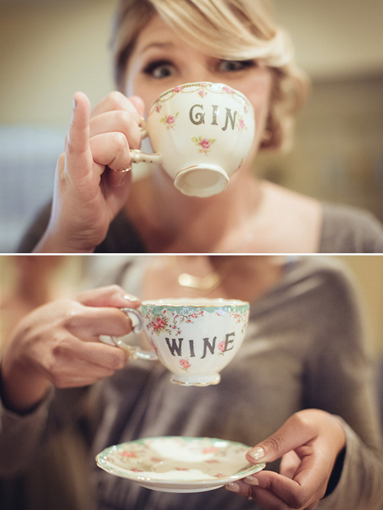 Woman enjoying gin and wine from vintage teacups, funny concept