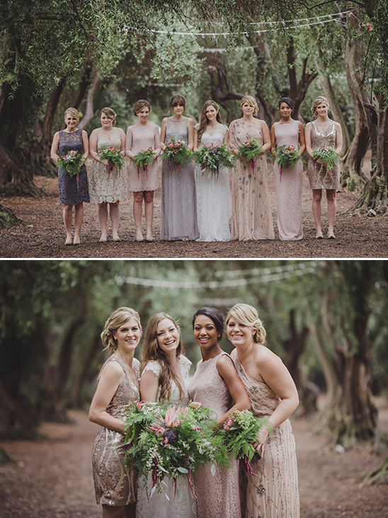 Bridesmaids in elegant dresses holding bouquets in a forest setting
