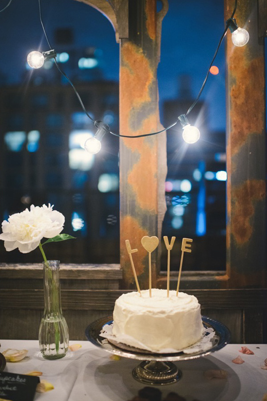 simple love topped wedding cake @weddingchicks
