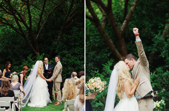 Wedding ceremony with bride and groom kissing under a tree