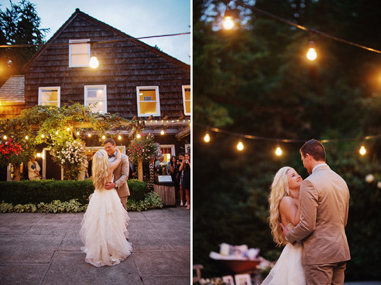 Couple dancing at outdoor wedding under string lights