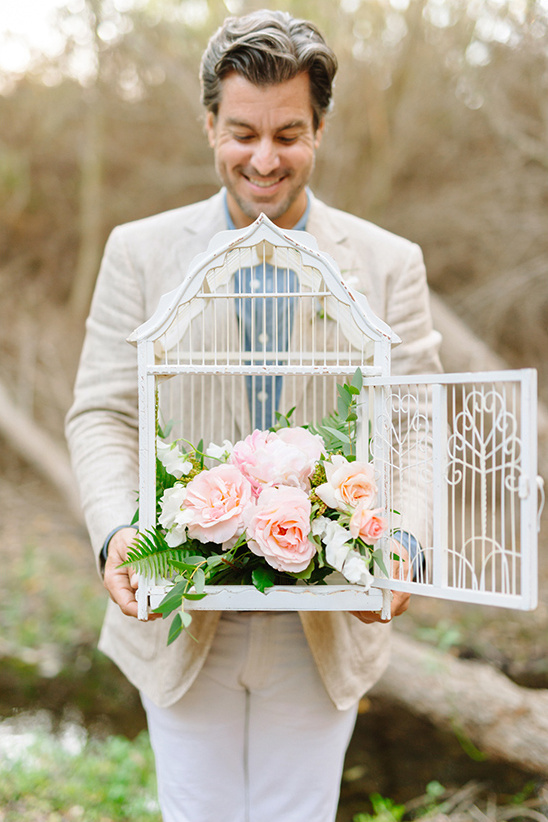 flower filled bird cage @weddingchicks