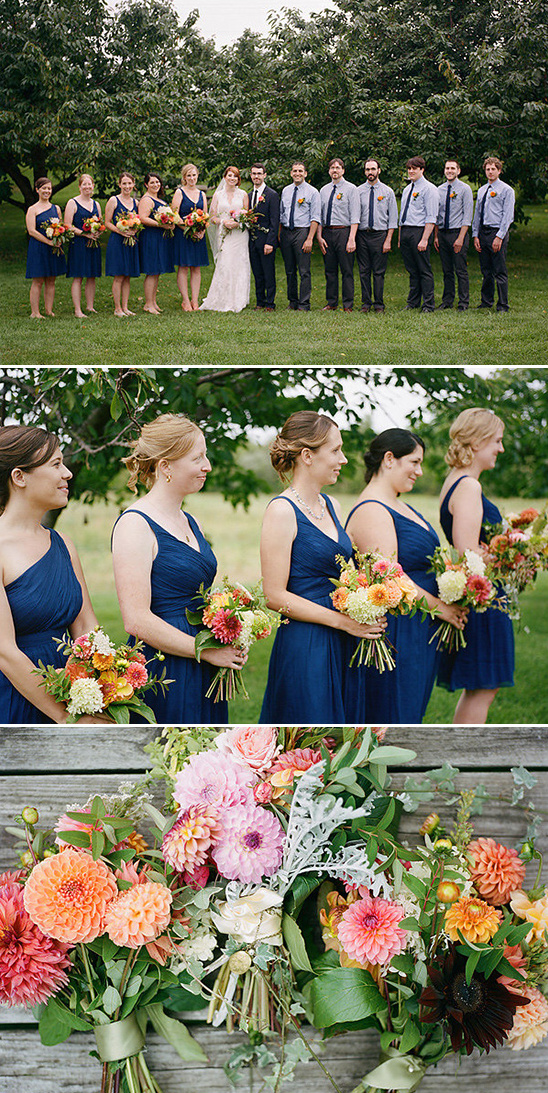 Wedding party in blue dresses and groomsmen with colorful bouquets