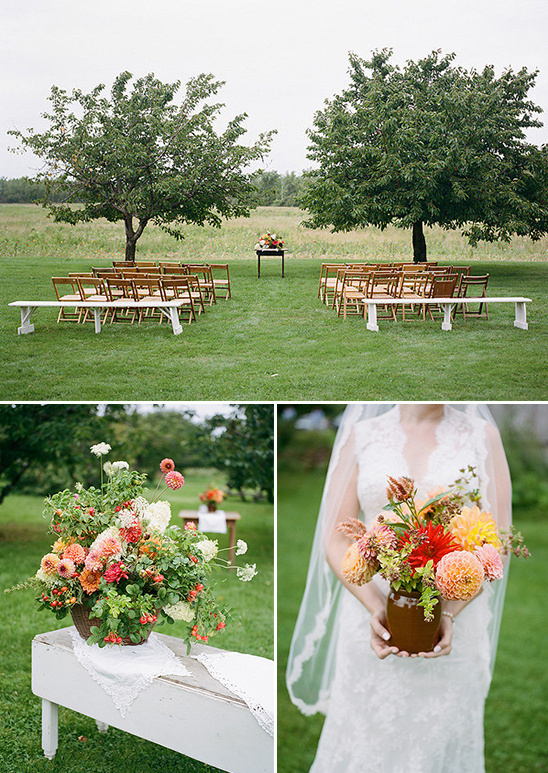 Outdoor wedding ceremony with flowers and bride holding bouquet