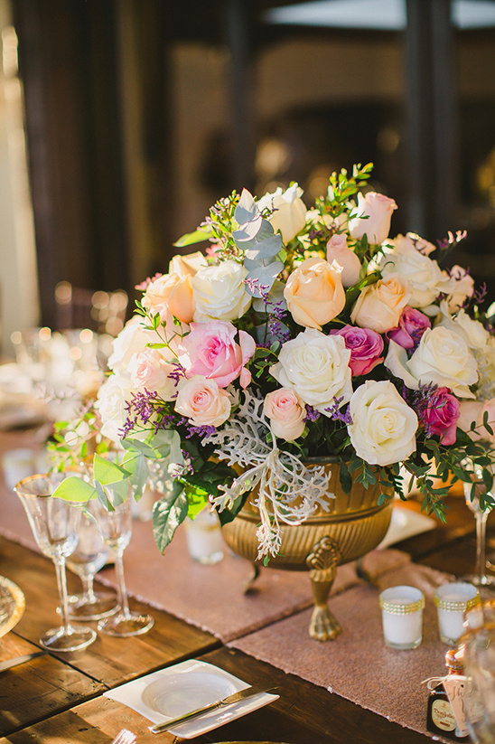 Elegant floral centerpiece decorates a wedding reception table