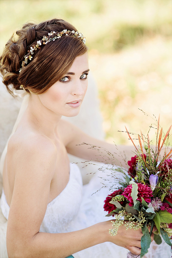Elegant bride with a floral bouquet and bridal hairpiece