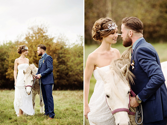Bride and groom pose with a horse on their wedding day