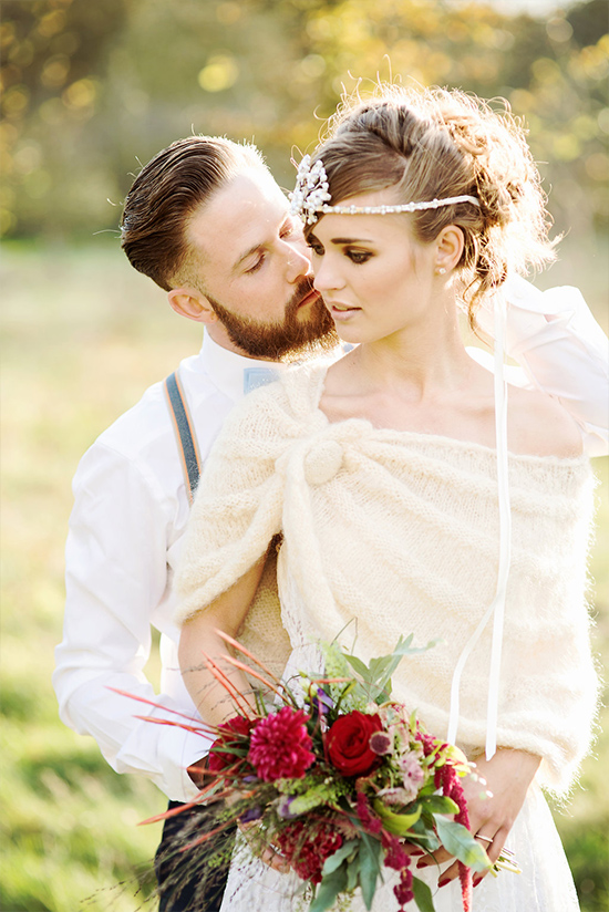 Romantic couple embracing in a field, wedding day bliss