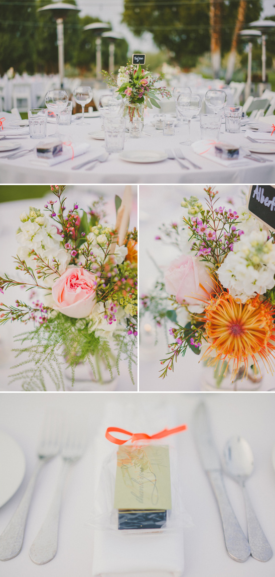 Elegant wedding table setting with floral centerpieces and favors