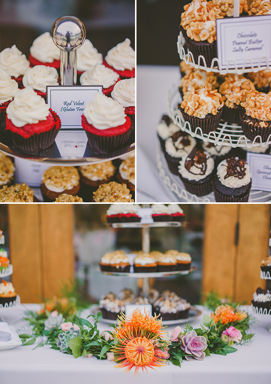 Delectable cupcake display at an elegant dessert table with florals