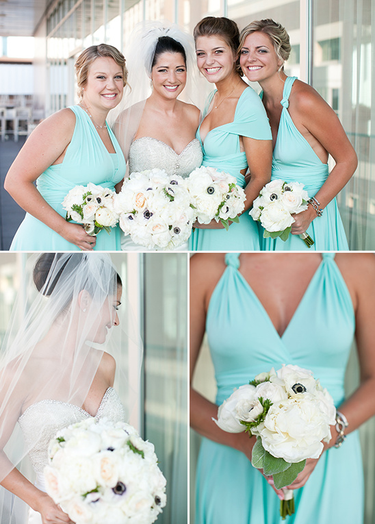 Bride and bridesmaids in teal dresses with white bouquets