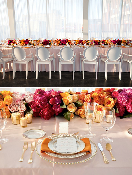 Elegant wedding table setting with vibrant floral centerpiece