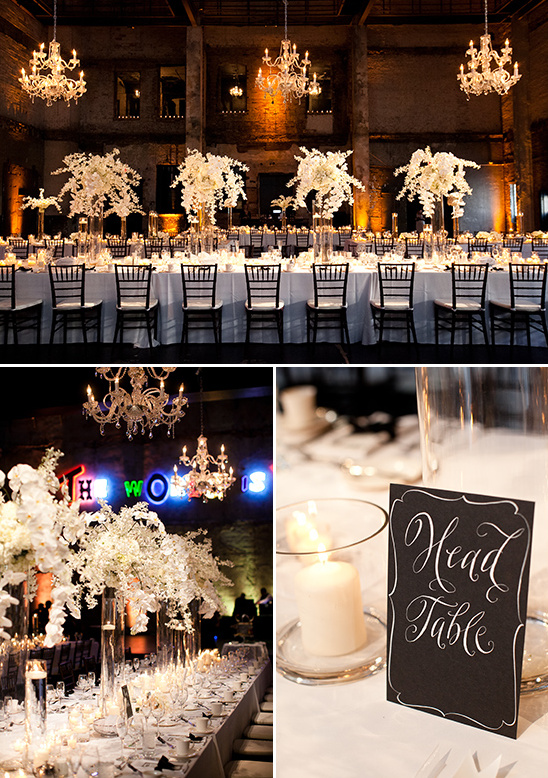 Elegant wedding reception decorated with white flowers and chandeliers