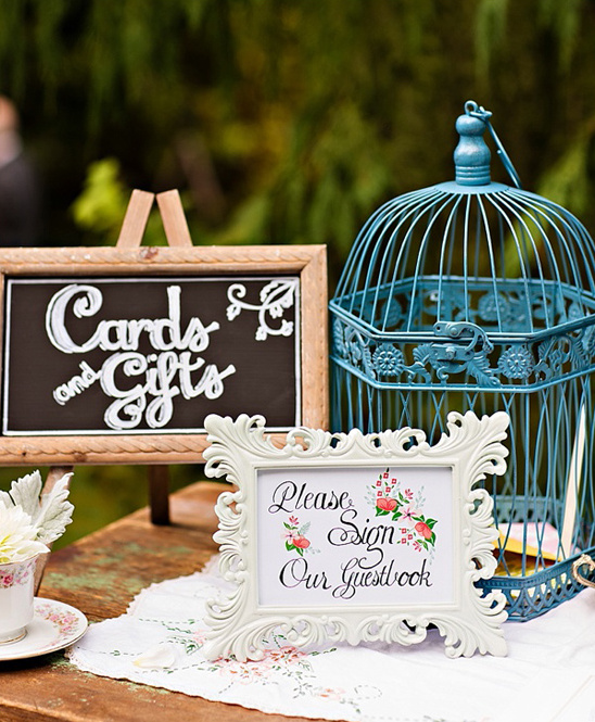vintage bird cage and welcome sign @weddingchicks