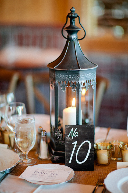 vintage lantern centerpiece and table number @weddingchicks