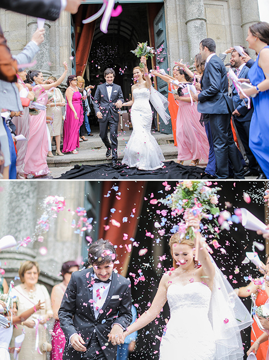 Happy couple exiting church, showered with confetti