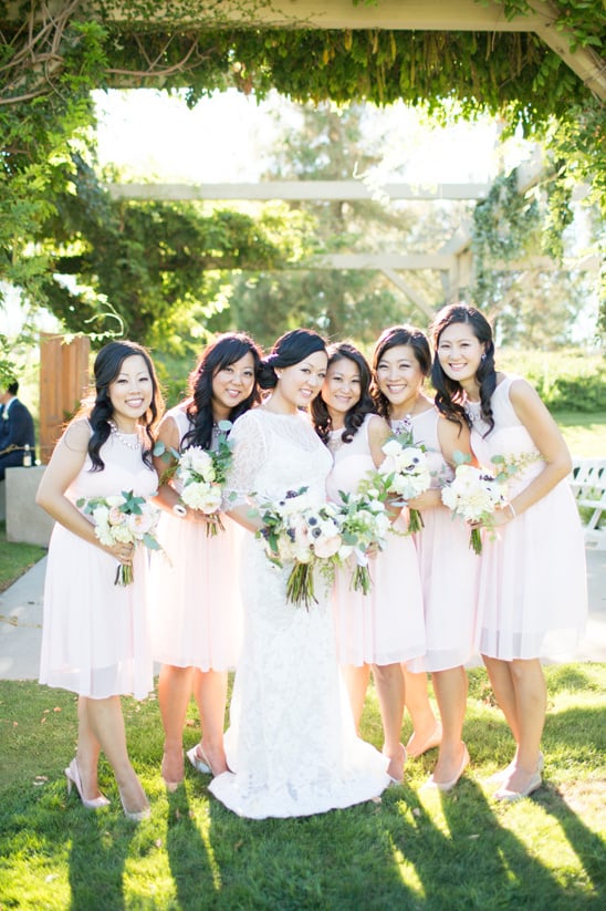 bridesmaids in white cocktail length dresses @weddingchicks
