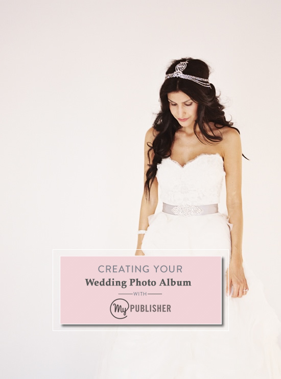 Bride in white wedding dress with photo album design inspiration