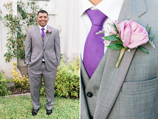 Groom in gray suit with purple tie and boutonniere