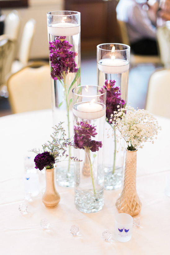 Elegant floral wedding table centerpiece with floating candles