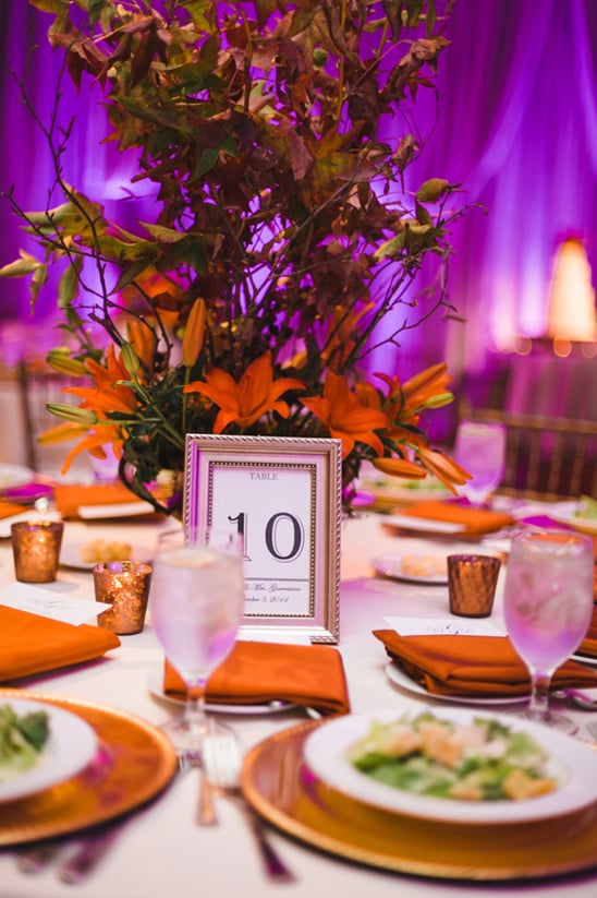 purple orange and gold reception table decor @weddingchicks