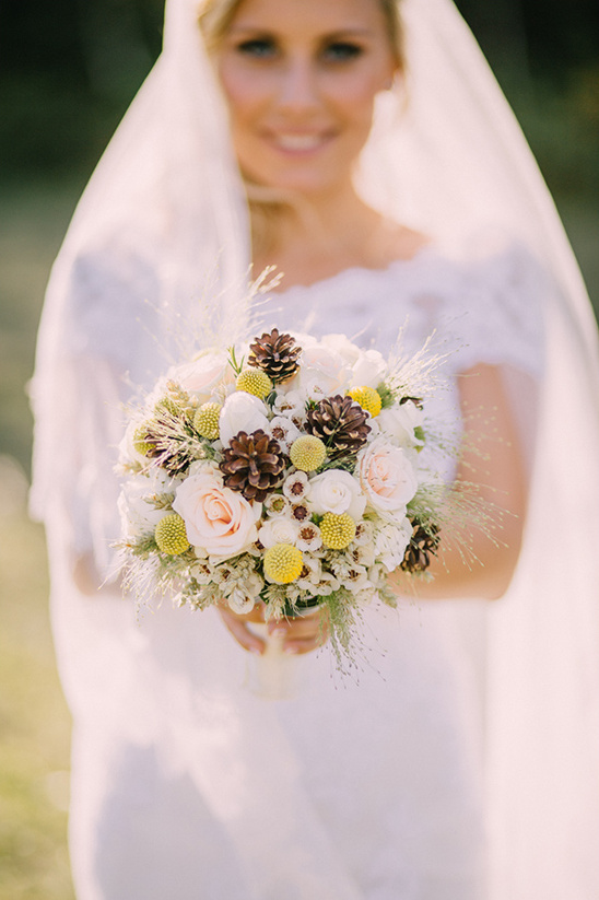 bridal bouquet with pine cones @weddingchicks